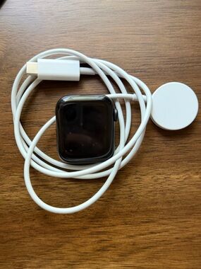 Apple Smartwatch with White Magnetic Charger - Black Watch Face